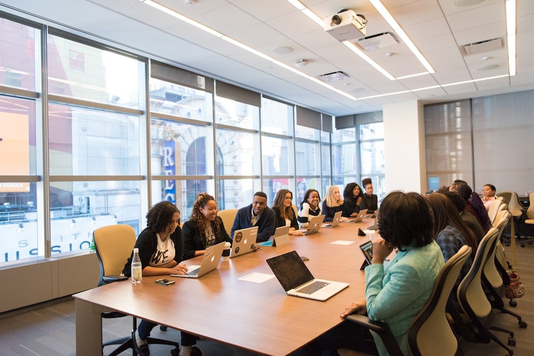 Team working together at a table with laptops
